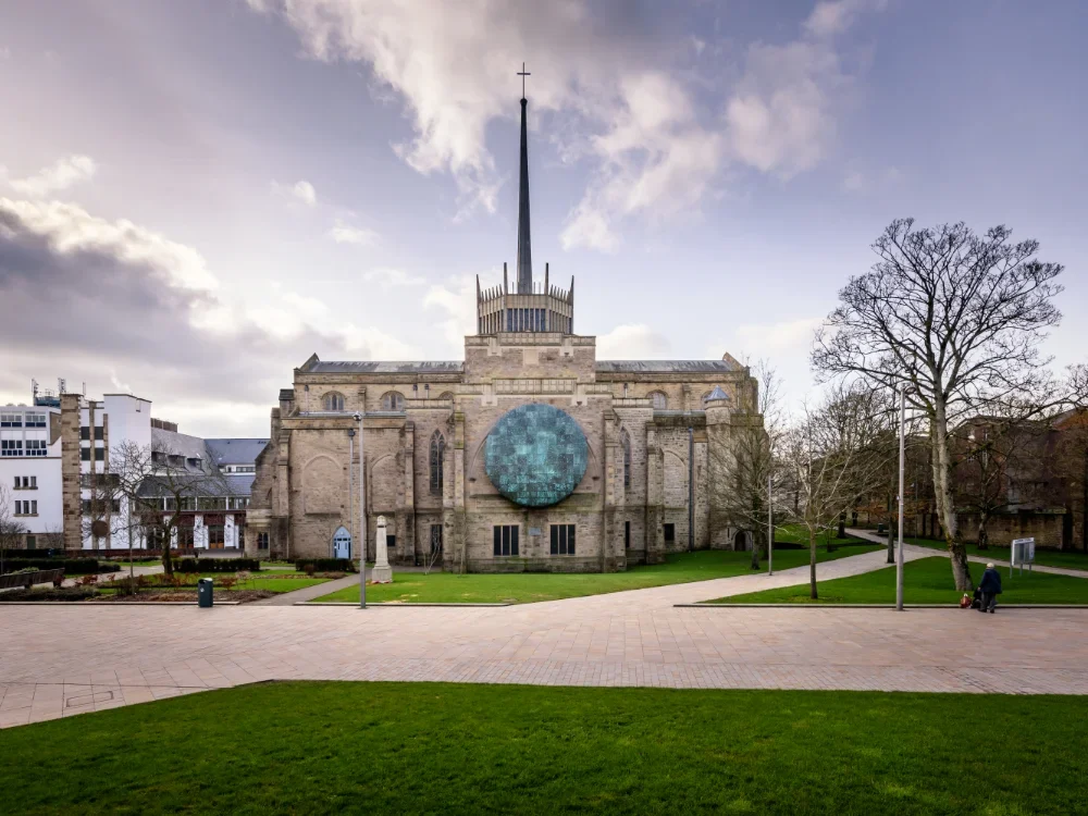 A photo of Blackburn Cathedral against a partly cloudy sky.